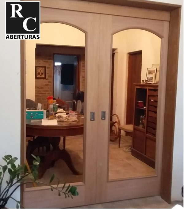Puerta corrediza de dos hojas en madera (Modelo 101 Curva)